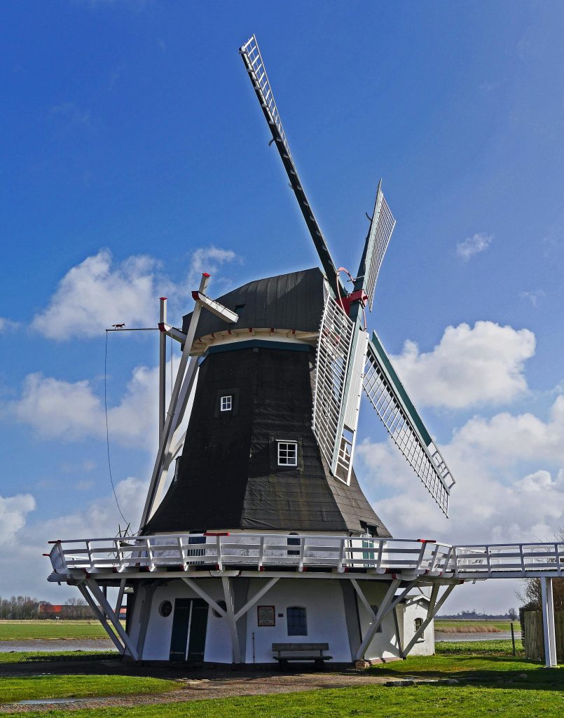 White and Black Wooden Windmill during Daytime
